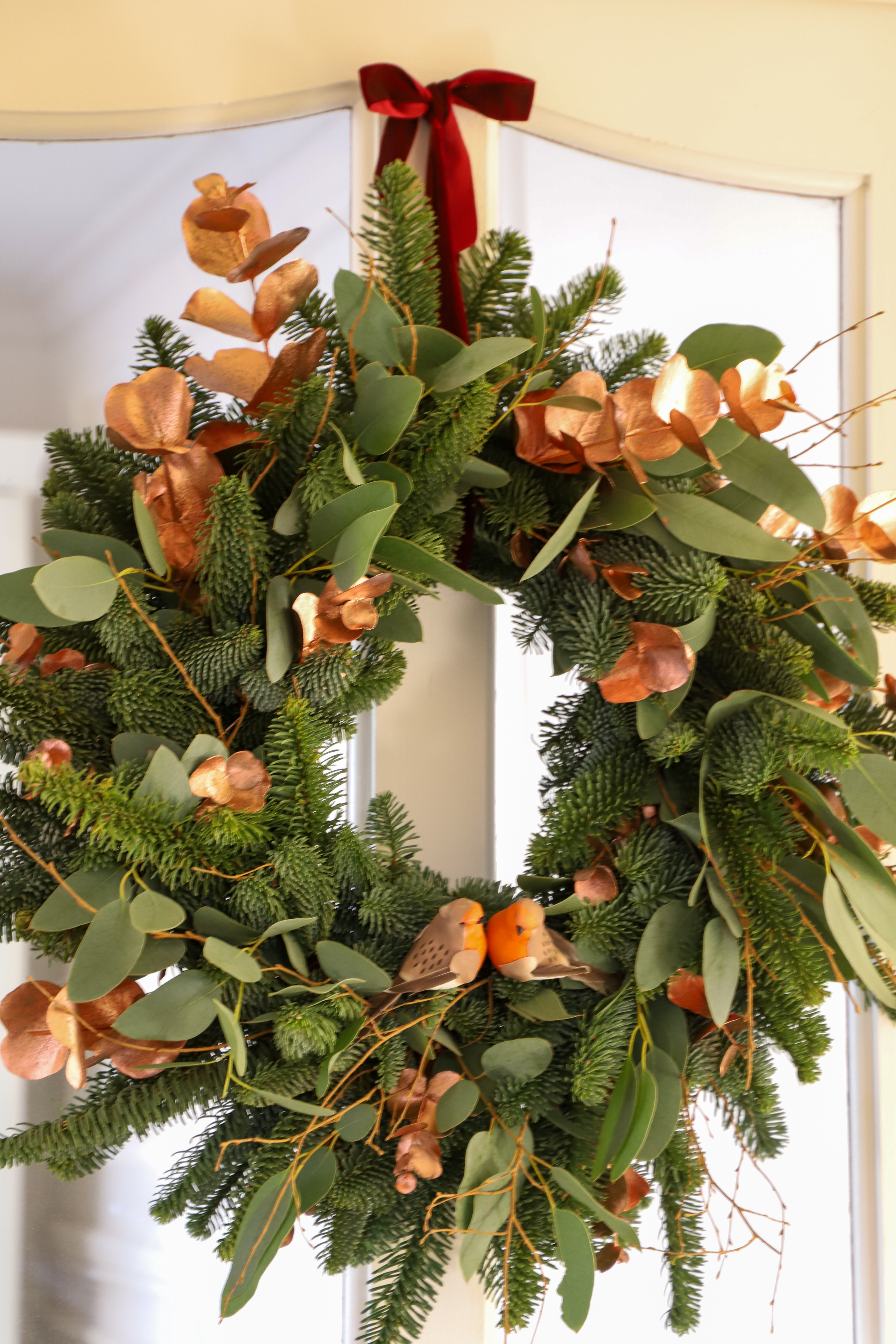 Finished Christmas wreath with ribbon and ornaments