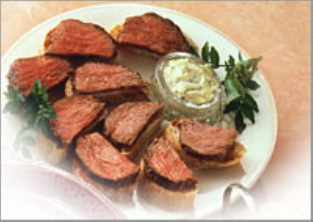 Marinated Fillet of Beef with Herb Dressing on Crusty Bread